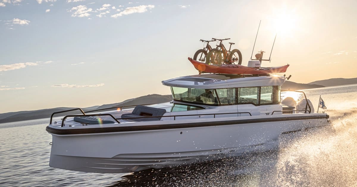 A motor cruiser underway in golden evening light